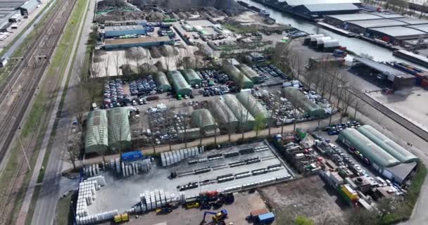 Scrapyard compound old broken discarded wreckage auto vehicles on a scrap junkyard facility for disposal in Utrecht, The Netherlands. Aerial drone — Stock Video