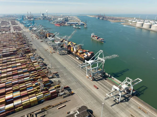 Rotterdam, 18th of april 2022, The Netherlands. Container terminal logistic ship loading and unloading of import and export dock commercial harbour aerial drone view. freight business —  Fotos de Stock