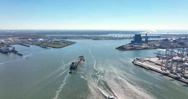 Port of Rotterdam harbour and logistical terminal. Shipping water sea canal transport and business logistics facility in the Netherlands. Large vessels. — Video