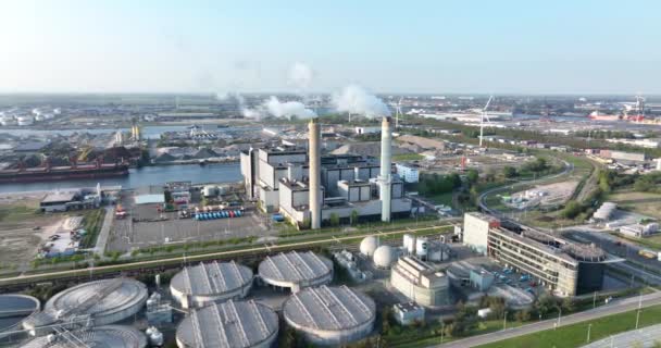 Amsterdam, 23th of april 2022, The Netherlands. smoking chimney waste incineration disposal renewal processing plant facility. Electricity generator industry business building. — Vídeo de stock