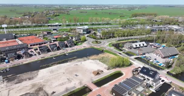 Modern suburb sustainable residential area household housing homes aerial drone view. New Build real estate european houses cityscape development of living space. Holland. Construction area. — Stock videók