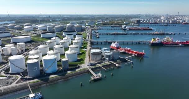 Rotterdam, 18th of april 2022, The Netherlands. Chemical oil products tanker ships and silos. Heavy large industrial dock in Rotterdam. — Vídeos de Stock