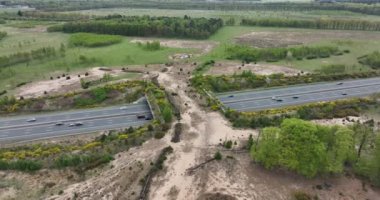 Ecoduct ecopassage or animal bridge crossing over the A12 highway in the Netherlands. Structure connecting forrest ecology landscape over the freeway