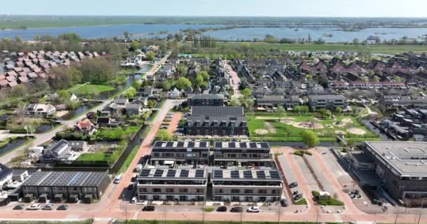 Modern suburb sustainable residential area household housing homes aerial drone view. New Build real estate european houses cityscape development of living space. Holland — Stok Video