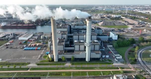 Amsterdam, 23th of april 2022, The Netherlands. smoking chimney waste incineration disposal renewal processing plant facility. Electricity generator industry business building. — Video