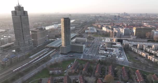 Amsterdam, 23th of March 2022, The Netherlands. Omval office buildings. Skyline aerial along the river and Amstel station infrastructure urban business district. Rembrandt tower cityscape. — стоковое видео