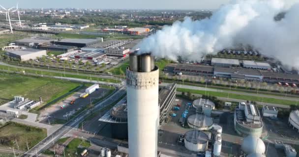 Amsterdam, 23th of april 2022, The Netherlands. smoking chimney waste incineration disposal renewal processing plant facility. Electricity generator industry business building. — стоковое видео