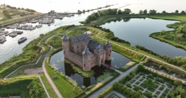 Medieval stronghold castle restored heritage culture monument for touristic museum purpose. Aerial overhead view. Dutch Holland fortification landmark full of history. Europe