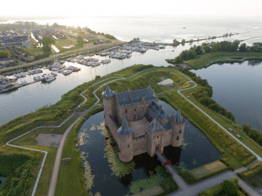Medieval stronghold castle restored heritage culture monument for touristic museum purpose. Aerial overhead view. Dutch Holland fortification landmark full of history. Europe