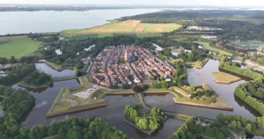 Fortified ancient old historic town of Naarden Vesting overhead aerial drone view of monumental ancient fort at the Zuiderwaterlinie medieval fortress defenisive vest landmark.