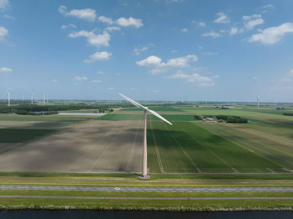 Wind turbine system sustainable energy generation on a wind farm in the countryside.