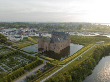 Medieval stronghold castle restored heritage culture monument for touristic museum purpose. Aerial overhead view. Dutch Holland fortification landmark full of history. Europe
