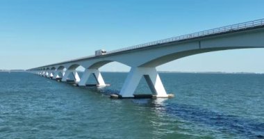 Zeelandbrug endless bridge. Transportation bridge connection road over water. Engineering long beautifull overhead road. Infrastructure crossing over the north sea.