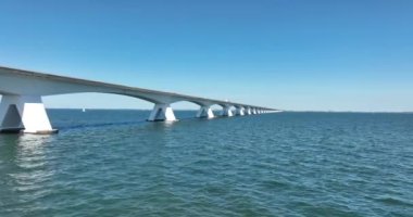 Zeelandbrug endless bridge. Transportation bridge connection road over water. Engineering long beautifull overhead road. Infrastructure crossing over the north sea.