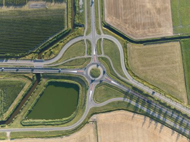 Roundabout junction aerial vehicle auto motorway intersection. Transportation safety crossroad. Circular ring road infrastructure street.
