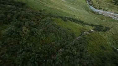 Switzerland alp alpine drone aerial glide fly through and over river. Mountain surfing swiss alps pass Sustenpass outdoor adrenaline adventure flying in hike trekking nature.