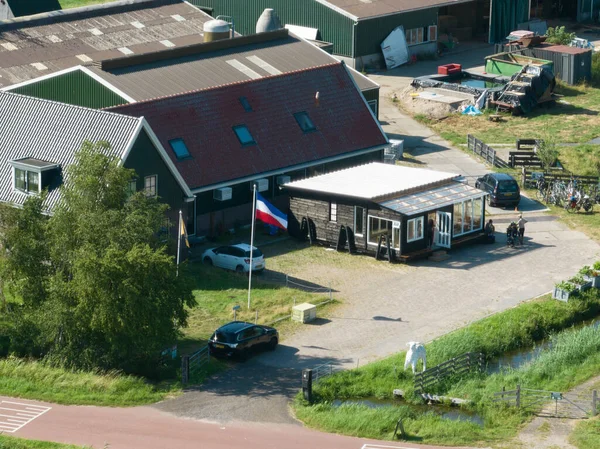Farmers protest in The Netherlands, dutch flag upside down. Protest actions by different groups of farmers. Goverenment wants to limit livestock farming to solve the nitrogen crisis.