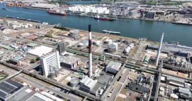 Antwerpen, 9th of August 2022, Belgium. Port of Antwerpen Kanaaldok B1 Europe second largest seaport. Industrial commercial and petro chemical zone. Vessels ships and economical activity companies