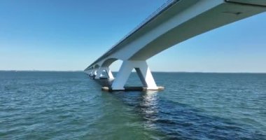 Zeelandbrug endless bridge. Transportation bridge connection road over water. Engineering long beautifull overhead road. Infrastructure crossing over the north sea.
