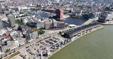 Antwerpen , 9th of August 2022, Belgium. MAS - Museum aan de Stroom and city skyline and Loodswezen Schipperskwartier. Downtown city center aerial drone overview.