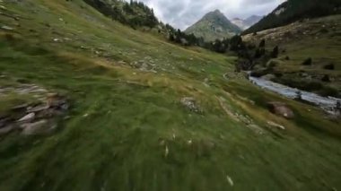 Switzerland alp alpine drone aerial glide fly through and over river. Mountain surfing swiss alps pass Sustenpass outdoor adrenaline adventure flying in hike trekking nature.