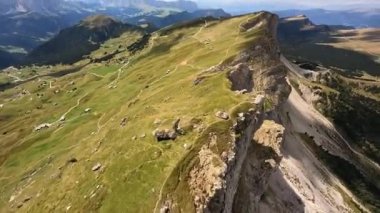 The Dolomites are a mountain range in Italy that is part of the Southern Limestone Alps hiking outdoor trekking beautifull majestic rugged cliffs with green grass. Unesco world heritage landscape
