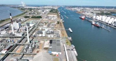 Antwerpen, 9th of August 2022, Belgium. Port of Antwerpen Kanaaldok B1 Europe second largest seaport. Industrial commercial and petro chemical zone. Vessels ships and economical activity companies