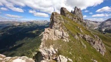 The Dolomites are a mountain range in Italy that is part of the Southern Limestone Alps hiking outdoor trekking beautifull majestic rugged cliffs with green grass. Unesco world heritage landscape