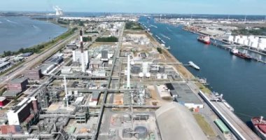 Antwerpen, 9th of August 2022, Belgium. Port of Antwerpen Kanaaldok B1 Europe second largest seaport. Industrial commercial and petro chemical zone. Vessels ships and economical activity companies