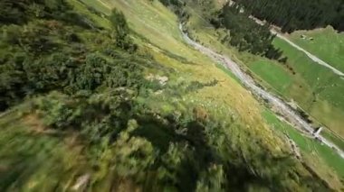 Switzerland alp alpine drone aerial glide fly through and over river. Mountain surfing swiss alps pass Sustenpass outdoor adrenaline adventure flying in hike trekking nature.