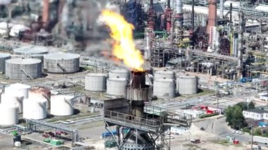 Flaring combustion of gases released during petroleum production. Refinery in the port of Antwerpen in Belgium.