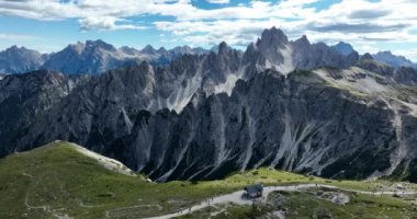 The Dolomites mountain range in Italy that is part of the Southern Limestone Alps . Typical for the Dolomites are the steep cliffs and peaks, which were created by erosion and weathering. Aerial drone