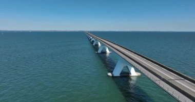Zeelandbrug endless bridge. Transportation bridge connection road over water. Engineering long beautifull overhead road. Infrastructure crossing over the north sea.