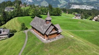 Fronalpstock Klingenstock wooden chapel in Stoos in central Switzerland a small wintersport ski resort village. Grassland alps alpine town on a clear sunny summer day. Clear mountain air and sky