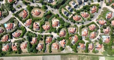 Vacation bungalow park accomodation leisure resort in Zeeland, The Netherlands. Summer cabin village cottage overhead drone aerial to spend holidays.