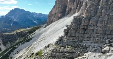 The Dolomites mountain range in Italy that is part of the Southern Limestone Alps . Typical for the Dolomites are the steep cliffs and peaks, which were created by erosion and weathering. Aerial drone