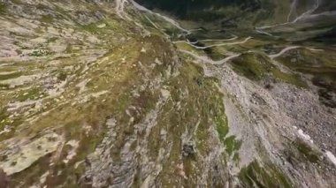 Switzerland Susten Pass mountain pass in the Swiss Alps. Connecting Innertkirchen with Wassen. Aerial flying smooth cliff hiking adventure outdoor speed. Asphalt road over the alps.