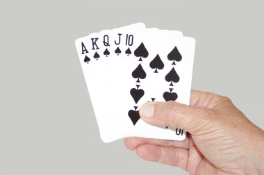 Isolated Hand Held Royal Flush Of Spades clipart