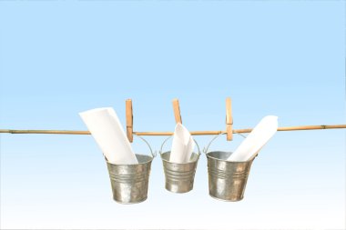 Three Galvanized Buckets Pegged On Bamboo Stick clipart