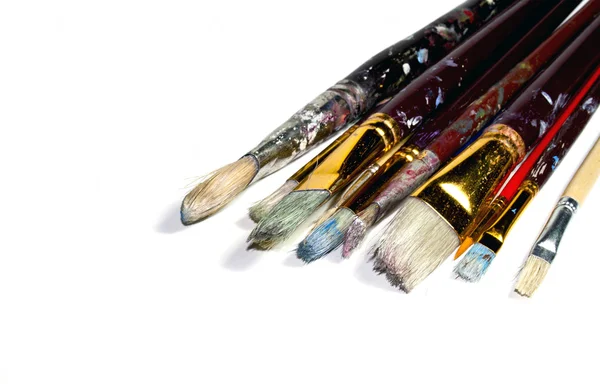 Ten Used Artist's Paint Brushes on White — Stock Photo, Image