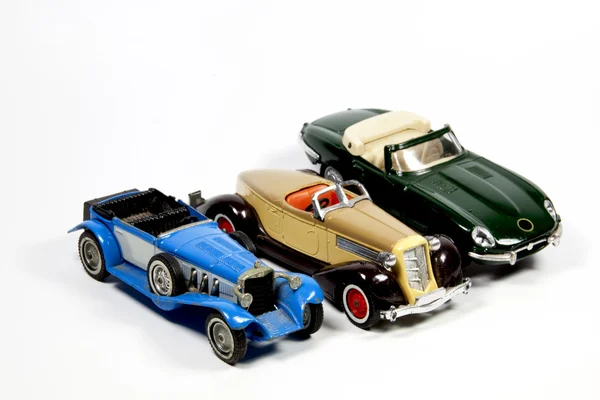 Zbiór trzech samochodzików model na białym tle — Zdjęcie stockowe