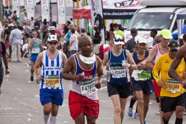 Determined Competitors Competing in Comrades Ultra Marathon clipart