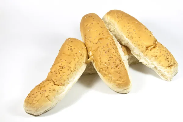 Golden Seeded Hotdog Rolls on White Background — Stock Photo, Image