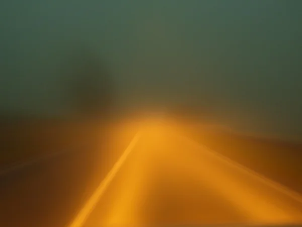 Blur car lights in autumn morning fog. — Stock Photo, Image