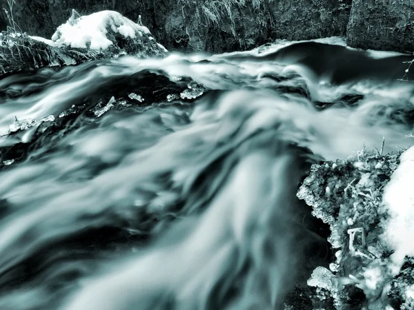 Icicles in trunk at waterfall. — Stock Photo, Image