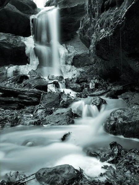 Night winter view to icicles and icy boulders into the stream. — Stock Photo, Image