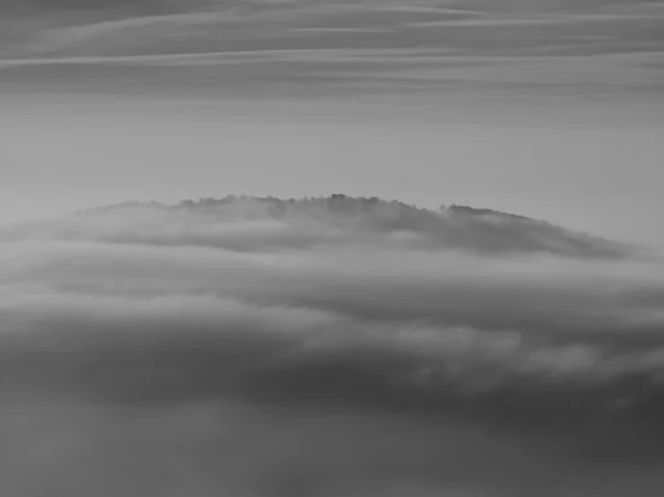 Autumn sunrise in a beautiful mountain of Bohemia. Peaks of hills increased from fog. — Stock Photo, Image