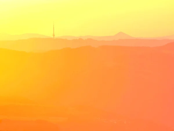 Magnificent orange fogy daybreak, beautiful spring misty sunrise above valley and hills. — Stock Photo, Image