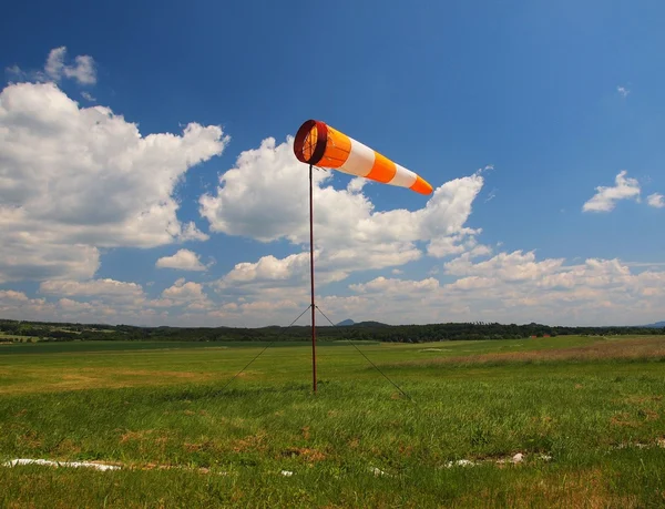 Summer hot day on sport airport with Abandoned  windsoc, wind is blowing and windsock is moving — Stock Photo, Image