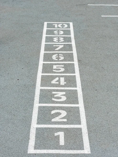 Classic Hopscotch Game Being Drawn Chalk Gray Ground Seen Start — Stock Photo, Image